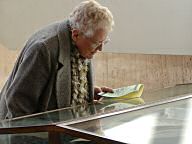 Moviegoer inspects memorabilia display in the lobby