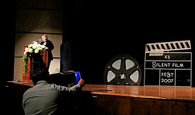 Denise introduces Friday night short films, Bill Shaffer stands ready at DVD player
