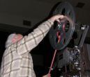 Rick winds leader onto projection reel