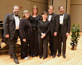 Mont Alto Motion Picture Orchestra on stage, posing with Phyllis