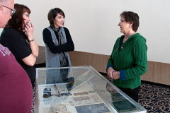 Melissa Talmadge Cox discusses heirlooms she is sharing in the display case