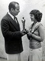 Janet Gaynor accepts her Oscar from Douglas Fairbanks Sr.