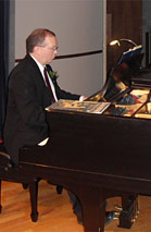 Phil Figgs plays piano for THE MAGICIAN, with Mutt and Jeff.