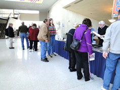 Fans browse. Larry Sanglas from Newton, KS, chats with Susan Rapsis, New Hampshire