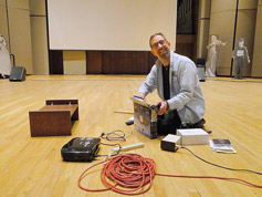 Karl Mischler dismantling the DVD projector onstage