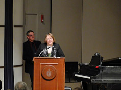Denise speaks on Saturday evening, with Bill Shaffer, who had a tough day, pausing stage right