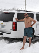 Karl Mischler, in Topeka from New York City, relaxes outdoor after exiting the motel sauna