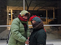 Mother and son bundle up to head home in the winter storm, Saturday evening