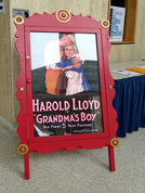 Marquee advertises Friday night showing of Harold Lloyd in Gramdma's Boy