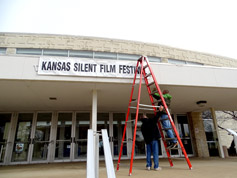 Trevor and Karl post the KSFF banner at White Concert Hall, Washburn University, Topeka