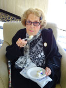 June Windscheffel enjoys birthday cake