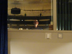 Washburn staffer, Lylie Werner watches house activity from his booth at the top of the balcony