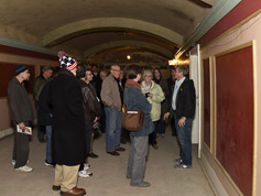Bill and tour group in the balcony hallway