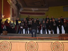 Bill and tour group stand in the balcony area A