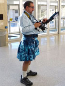 Karl Mischler with his camera and his kilt