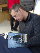 Sergio Delgado signs books C
