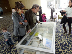 Attendees enjoy display case showing