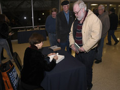 Dr. Harriet Fields signs copies of her book about her grandfather, W.C. Fields. In line are Blair Tarr (Topeka, KS), Richard Allen Brown (Topeka, KS), and Vergil Noble (Ashland, NE)
