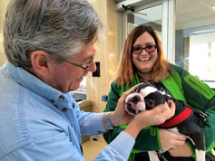 Bill Shaffer enjoys the grin of pet dog of Melanie Lawrence