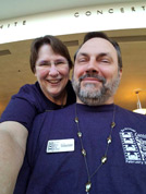 Jane Bartholomew creates a selfie with volunteer Brian Sanders