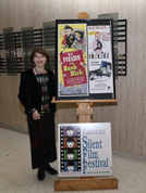 Dr. Harriet Fields beside W.C. Fields features posters