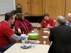 Carol Yoho leads the table discussion during breaktime in the Green Room — with Marvin Faulwell
