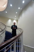 Larry Stendabach takes photos from stairway