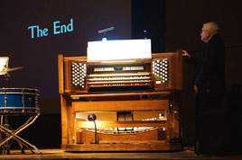Bill Beningfield stand by the White Concert Hall organ