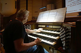 Marvin Faulwell sets up the organ on Thursday evening