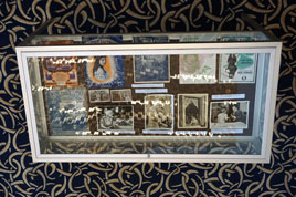 Looking at lobby display case from staircase above