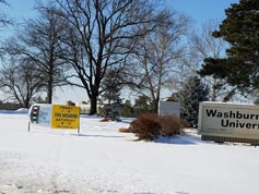 Snow arrived soon after banners were posted at the four corners of Washburn U. campus