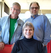 Bill Shaffer and Robert Bader pose behind Tracey Goessel at Bobo Drive-in