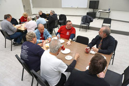 Staff members and volunteers have lunch backstage on Friday afternoon