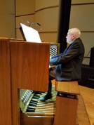 Bill Beningfield rehurses his organ accompaniment on the White Concert Hall pipe organ