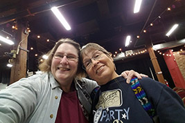 Jane Bartholomew, from Overland Park, KS, welcomes Louise Langberg, a donor who attends regularly from St. Paul, MN.