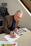J.B. Kaufman signing a book