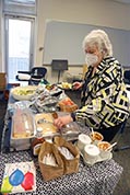 Meal assistant volunteer ______ helped set up lunch at Washburn University on Saturday.