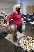 Meals-teamster Nancy Lawrence helped pour iced tea at our lunch in a small classroom at Washburn University.