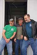 Portrait photo of Karl Mischler, Bill Shaffer and Brian Sanders in storage unit doorway...work DONE for 2023!