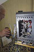 Ken Filardo beging setting up his antique battery-powered movie projector
