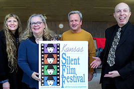 Kellee, Kelly and ____ join musician Ben Model to stand by the KSFF festival logo