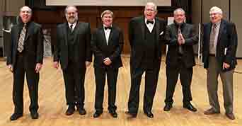 Our talents musicians, Ben Model, Rodney Sauer, Bob Keckeisen, Marvin Faulwell, Jeff Rapsis and Bill Beningfield, take a bow onstage on Saturday night