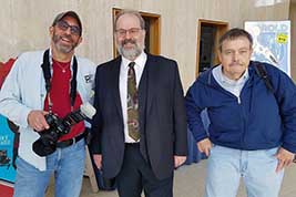 Staffer Karl Mischler stands with musician Rodney Sauer and projectionist Jim Reid