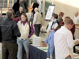 Attendees mill and discuss film