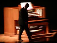 Dr. Fauwell leaves his station at the organ.
