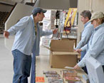Karl discusses plans with Bill and Denise