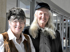 Carol and Richard wear their hats