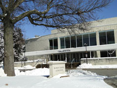 Grounds crews scooped snow from in front of White Concert Hall. The sun came out and the day looked much brighter than Thursday noon hour had!