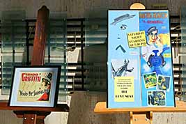 Movie posters on display in lobby: Raymond Griffith in