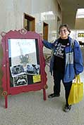 Louise Langberg of Minneapolis, Minnesota, poses beside this year's display-case
